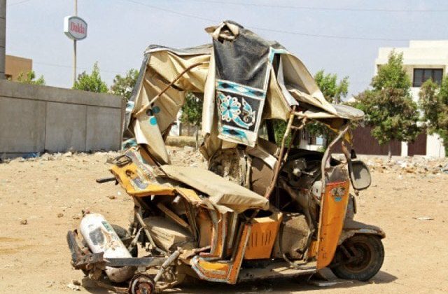"Destroyed school rickshaw after high-speed racing accident in Muzaffargarh, Pakistan"