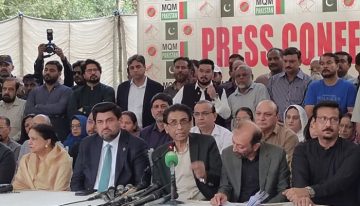 MQM Pakistan leadership addressing a press conference with party members seated and standing behind them.