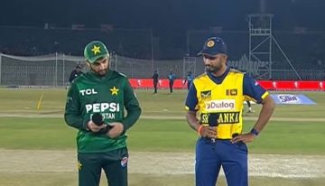 Pakistan and Sri Lanka cricket captains stand together at the pitch during the toss, with one holding the coin and the other speaking into the microphone before the start of the T20 tri-series match.