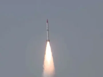 A Pakistan-made anti-ship ballistic missile launching into the sky, emitting bright flames during its successful test flight.