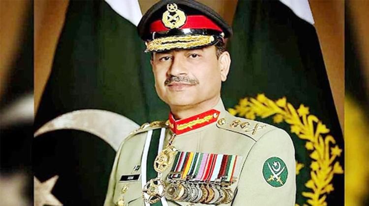 Portrait of Field Marshal Asim Munir in military uniform standing in front of Pakistan flags.