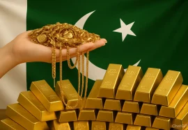 A hand holds a pile of gold jewelry above stacked gold bars, with the flag of Pakistan visible in the background.