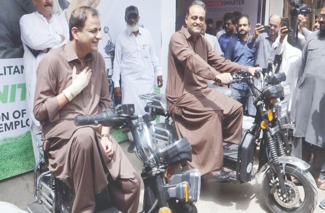 Karachi Mayor and officials testing new electric bikes during KMC e-bike launch ceremony in Karachi.