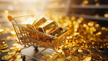 A miniature shopping cart filled with gold bars surrounded by scattered gold coins, symbolizing rising and falling gold market prices.