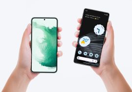 Two hands holding two modern Android smartphones, each displaying different home screens and app layouts.