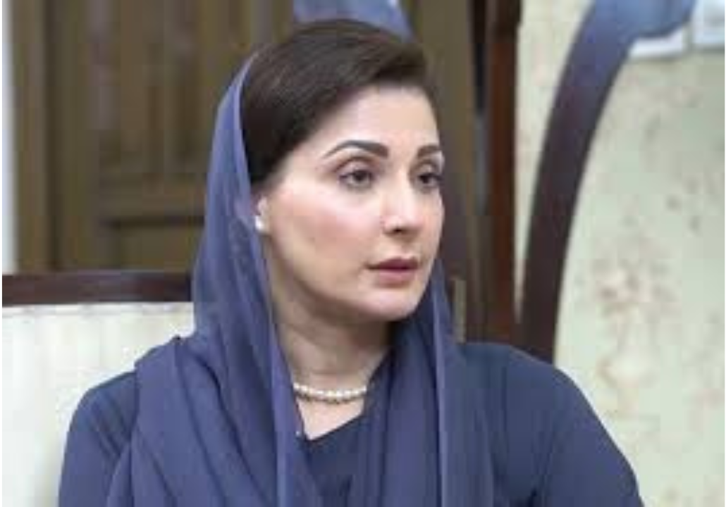 Maryam Nawaz sitting during an official meeting, wearing a blue headscarf, listening attentively to a briefing.