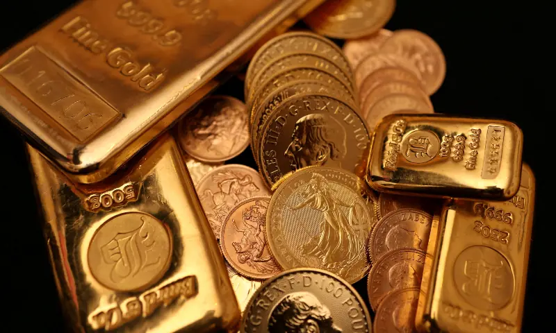 Gold bars and coins representing increase in gold price in Pakistan as per latest bullion market rates