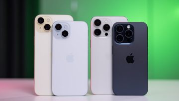 A lineup of four Apple iPhones in different colors, showing their rear designs and camera modules against a soft green background.