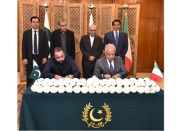 Pakistani and Italian officials signing a bilateral labor agreement to allocate job quotas for Pakistani workers in Italy.