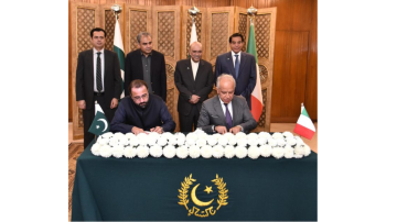 Pakistani and Italian officials signing a bilateral labor agreement to allocate job quotas for Pakistani workers in Italy.