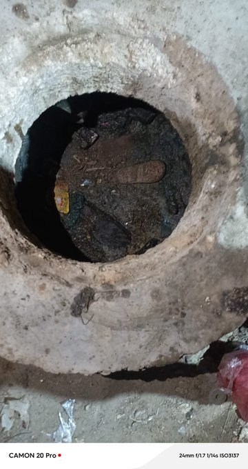 An open sewer manhole on a street in Karachi, posing a serious danger to pedestrians and children