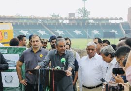 “PCB officials addressing media during stadium renovation briefing at a cricket ground, surrounded by press and staff.”