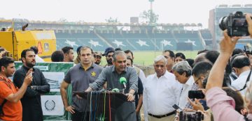 “PCB officials addressing media during stadium renovation briefing at a cricket ground, surrounded by press and staff.”