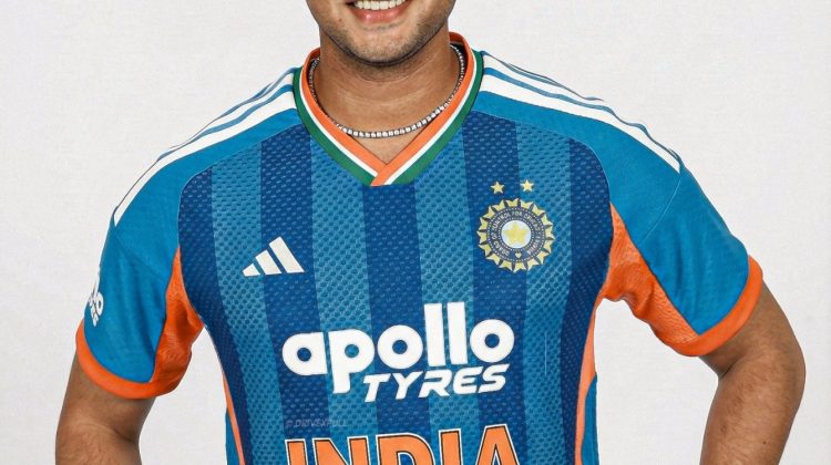 "Indian cricketer smiling in official Team India blue jersey during a photoshoot"