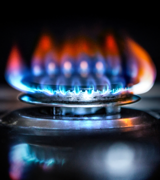 Gas stove burner with blue flame during 24-hour gas supply suspension in Karachi